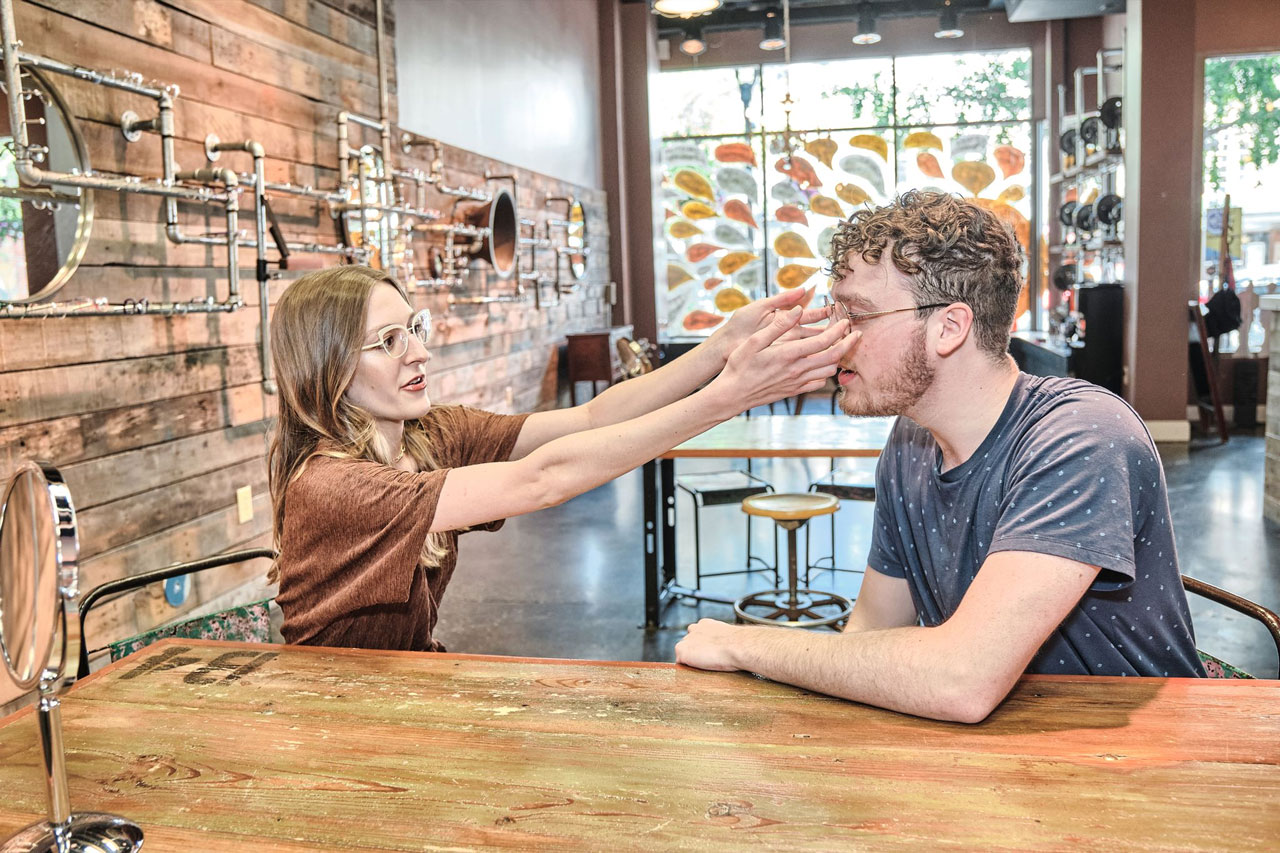 Doctor fitting eye glasses